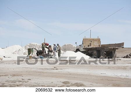 People Packaging Salt From The Salar De Uyuni In The Village Of Colchani, Potosi Department, Bolivia View Large Photo Image Stock Image - People Packaging Salt From The Salar De Uyuni In The Village Of Colchani, Potosi Department, Bolivia. Fotosearch