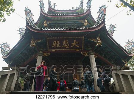 People praying and visiting Nan Pu Tuo Buddhist temple; Xiamen, Fujian Province, China View Large Photo Image Stock Photograph - People praying and visiting Nan Pu Tuo Buddhist temple; Xiamen, Fujian Province, China. Fotosearch