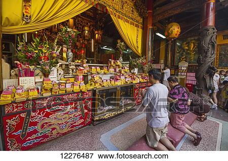 People praying at a shrine in the Altar of Heaven (Tiantan); Tainan, Taiwan View Large Photo Image Stock Photo - People praying at a shrine in the Altar of Heaven (Tiantan); Tainan, Taiwan. Fotosearch