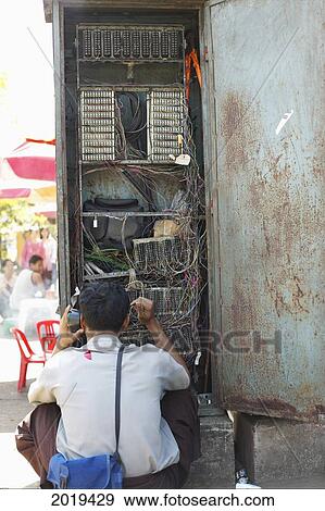 Person On A Phone, Yangon, Myanmar (Burma) View Large Photo Image Stock Photo - Person On A Phone, Yangon, Myanmar (Burma). Fotosearch