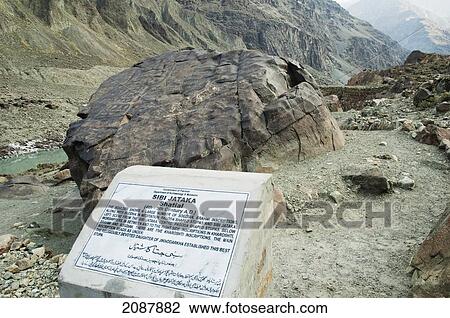 Stock Image - Petroglyphs On A Boulder Show A Large Of Number Of Sogdian And Brahmi Inscriptions, A Buddha In Mediation, Pagoda-Shaped Stupas And Scenes From The Sibi Jataka, Shatial Near Chilas, Northern Areas, Pakistan. Fotosearch