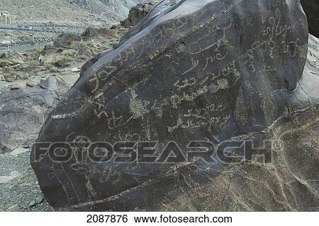 Petroglyphs On A Boulder Show Sogdian And Brahmi Inscriptions, Shatial Near Chilas, Northern Areas, Pakistan View Large Photo Image Stock Photograph - Petroglyphs On A Boulder Show Sogdian And Brahmi Inscriptions, Shatial Near Chilas, Northern Areas, Pakistan. Fotosearch