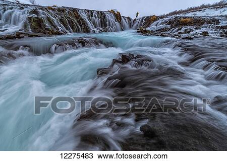 Photographer standing at the top of Bruarfoss taking photos; Iceland View Large Photo Image Stock Image - Photographer standing at the top of Bruarfoss taking photos; Iceland. Fotosearch