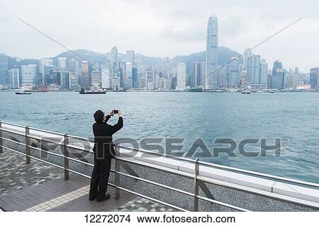 Picture - Pier from Kowloon to Hong Kong Island, spectacular skyline; Hong Kong, China. Fotosearch