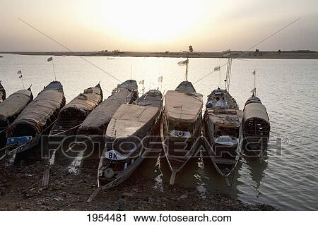 Pinasse Boats on the Niger River in Mopti, Mali View Large Photo Image Stock Image - Pinasse Boats on the Niger River in Mopti, Mali. Fotosearch