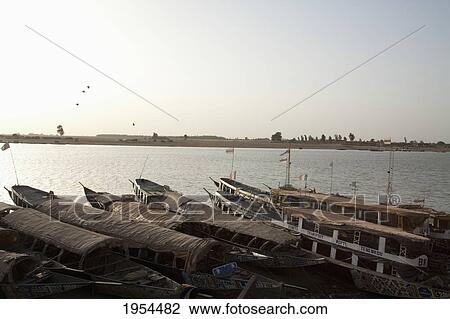 Pinasse Boats on the Niger River in Mopti, Mali View Large Photo Image Stock Image - Pinasse Boats on the Niger River in Mopti, Mali. Fotosearch