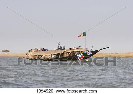 Pinasse carrying cargo and passengers on the Niger River between Mopti and Lake Debo, Mali View Large Photo Image Stock Image - Pinasse carrying cargo and passengers on the Niger River between Mopti and Lake Debo, Mali. Fotosearch