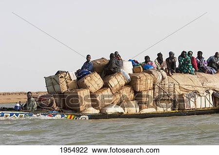 Pinasse carrying cargo and passengers on the Niger River between Mopti and Lake Debo, Mali View Large Photo Image Stock Image - Pinasse carrying cargo and passengers on the Niger River between Mopti and Lake Debo, Mali. Fotosearch