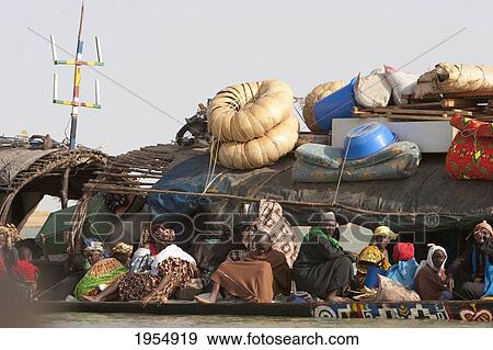 Stock Photo - Pinasse carrying cargo and passengers on the Niger River between Mopti and Lake Debo, Mali. Fotosearch