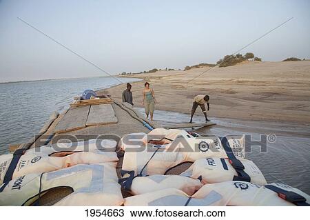 Stock Image - Pinasse carrying cargo and people on the Niger River between Niafunke and Kabara, Mali. Fotosearch