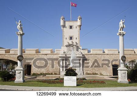 Plaza with column monuments, water fountain wall and flag on tower; Cadiz de la Frontera, Andalusia, Spain View Large Photo Image Stock Photo - Plaza with column monuments, water fountain wall and flag on tower; Cadiz de la Frontera, Andalusia, Spain. Fotosearch