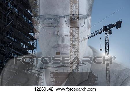 Portrait of a businessman with construction of a building and crane; Locarno, Ticino, Switzerland View Large Photo Image Stock Image - Portrait of a businessman with construction of a building and crane; Locarno, Ticino, Switzerland. Fotosearch