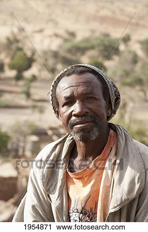 Portrait of a Dogon man in Tireli, Mali View Large Photo Image Stock Image - Portrait of a Dogon man in Tireli, Mali. Fotosearch