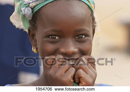 Portrait of a happy girl in Segou, Mali View Large Photo Image Stock Photograph - Portrait of a happy girl in Segou, Mali. Fotosearch