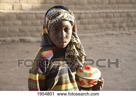 Portrait of a pre-teen girl in Djenne, Mali View Large Photo Image Stock Image - Portrait of a pre-teen girl in Djenne, Mali. Fotosearch