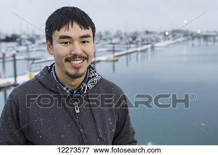 Portrait of an Alaskan native man in front of the Homer small boat harbor, Homer Spit, Southcentral Alaska View Large Photo Image Stock Photo - Portrait of an Alaskan native man in front of the Homer small boat harbor, Homer Spit, Southcentral Alaska. Fotosearch