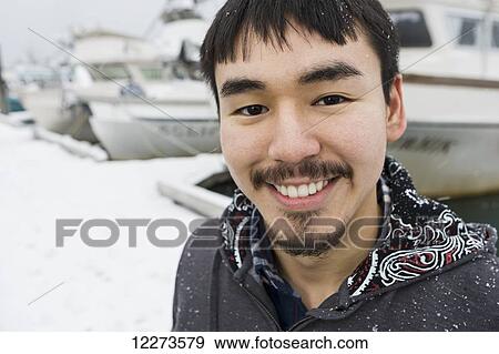 Portrait of an Alaskan native man in front of the Homer small boat harbor, Homer Spit, Southcentral Alaska View Large Photo Image Stock Photo - Portrait of an Alaskan native man in front of the Homer small boat harbor, Homer Spit, Southcentral Alaska. Fotosearch