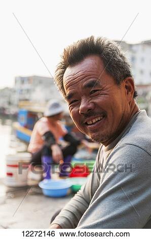 Portrait of fisherman in the traditional Shapowei; Xiamen, Fujian Province, China View Large Photo Image Stock Photograph - Portrait of fisherman in the traditional Shapowei; Xiamen, Fujian Province, China. Fotosearch