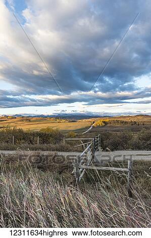 Stock Photograph - Prairie gate and big sky, near Longview; Alberta, Canada. Fotosearch