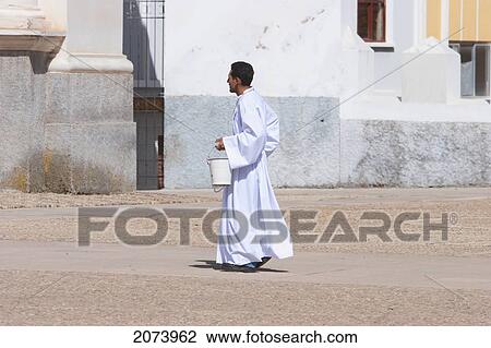 Priest In The Courtyard Of The Basilica De Virgen De La Candelaria, Copacabana, La Paz Department, Bolivia View Large Photo Image Stock Image - Priest In The Courtyard Of The Basilica De Virgen De La Candelaria, Copacabana, La Paz Department, Bolivia. Fotosearch