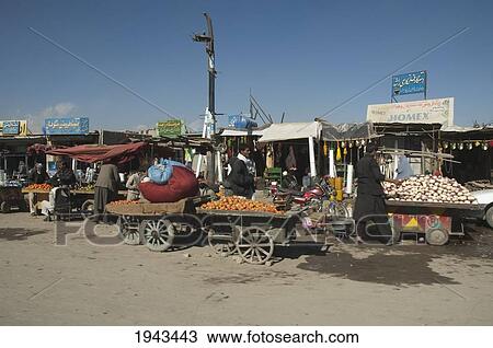Stock Image - Produce-Laden Carts On A Kabul Street,, Afghanistan. Fotosearch