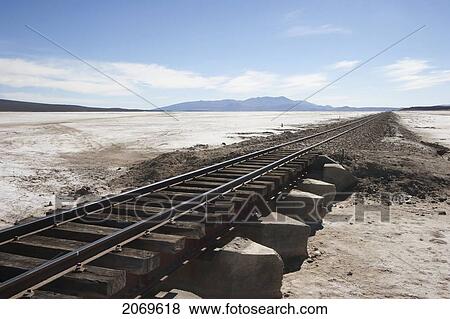 Railway Line Crossing The Salar De Chiguana, Potosi Department, Bolivia View Large Photo Image Stock Photo - Railway Line Crossing The Salar De Chiguana, Potosi Department, Bolivia. Fotosearch