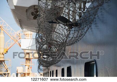 Stock Photo - Razor wire to deter Somali pirates, off Somalia, Gulf of Aden, Indian Ocean; Somalia. Fotosearch