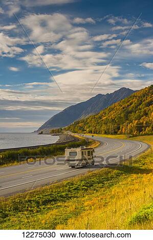 Stock Image - Recreational Vehicle on the Seward Highway along Turnagain Arm section of the Cook Inlet on a Fall day in South Central Alaska, HDR. Fotosearch