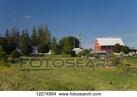 Red barn and windmill at a farm, near Edgewood; Iowa, United States of America View Large Photo Image Picture - Red barn and windmill at a farm, near Edgewood; Iowa, United States of America. Fotosearch