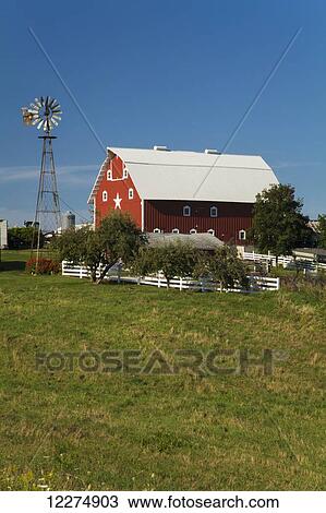 Red barn and windmill at a farm, near Edgewood; Iowa, United States of America View Large Photo Image Stock Image - Red barn and windmill at a farm, near Edgewood; Iowa, United States of America. Fotosearch