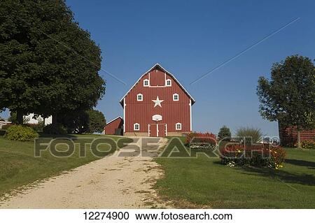 Stock Image - Red barn at a farm, near Edgewood; Iowa, United States of America. Fotosearch