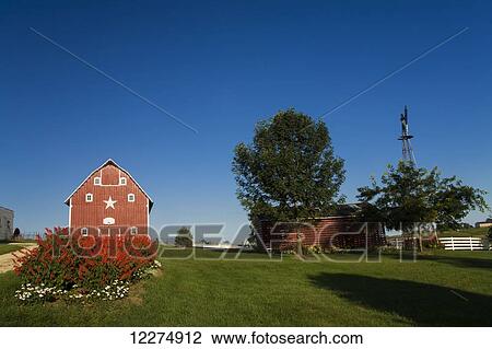 Stock Image - Red barn at a farm, near Edgewood; Iowa, United States of America. Fotosearch