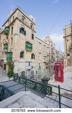 Red Telephone Booth And Buildings With Enclosed Balconies, Valletta, Malta View Large Photo Image Stock Image - Red Telephone Booth And Buildings With Enclosed Balconies, Valletta, Malta. Fotosearch