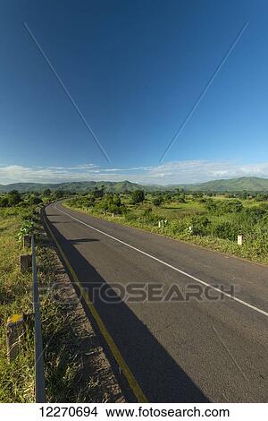 Road leading to hills in the late afternoon; Malawi View Large Photo Image Picture - Road leading to hills in the late afternoon; Malawi. Fotosearch