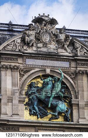 Stock Photograph - Rooftop of the Louvre with a statue honouring Emperor Napoleon III; Paris, France. Fotosearch