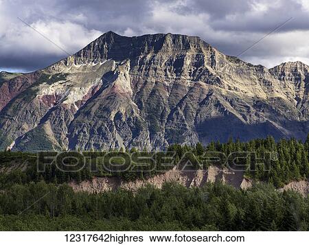 Rugged mountains and forested landscape, Waterton Lakes National Park; Alberta, Canada View Large Photo Image Stock Photograph - Rugged mountains and forested landscape, Waterton Lakes National Park; Alberta, Canada. Fotosearch