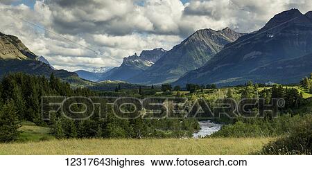 Stock Photograph - Rugged mountains and forested landscape, Waterton Lakes National Park; Alberta, Canada. Fotosearch