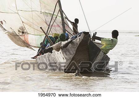 Stock Image - Sail boat on Lake Debo, formed by the seasonal flooding of the Niger River, Mali. Fotosearch