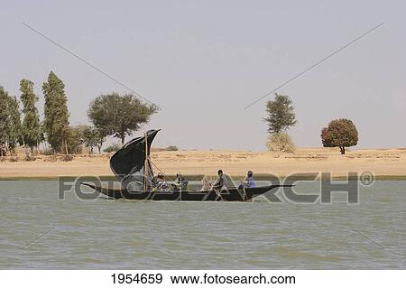 Sail boat on the Niger River between Niafunke and Kabara, Mali View Large Photo Image Stock Photo - Sail boat on the Niger River between Niafunke and Kabara, Mali. Fotosearch