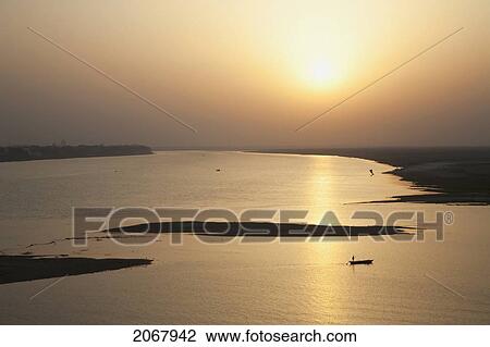Sailboat On The Ganges River At Sunset, Patna, Bihar, India View Large Photo Image Stock Image - Sailboat On The Ganges River At Sunset, Patna, Bihar, India. Fotosearch