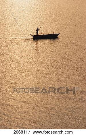 Sailboat On The Ganges River At Sunset, Patna, Bihar, India View Large Photo Image Stock Photo - Sailboat On The Ganges River At Sunset, Patna, Bihar, India. Fotosearch