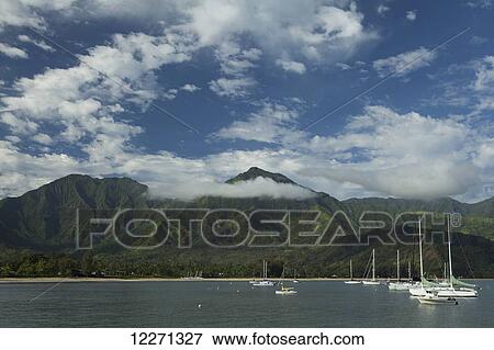 Stock Photo - Sailboats and Hanalei Beach in the bay and valley; Hanalei, Kauai, Hawaii, United States of America. Fotosearch