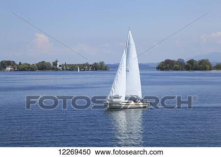 Sailing in a tranquil lake; Am Chiemsee, Bayern, Germany View Large Photo Image Stock Image - Sailing in a tranquil lake; Am Chiemsee, Bayern, Germany. Fotosearch