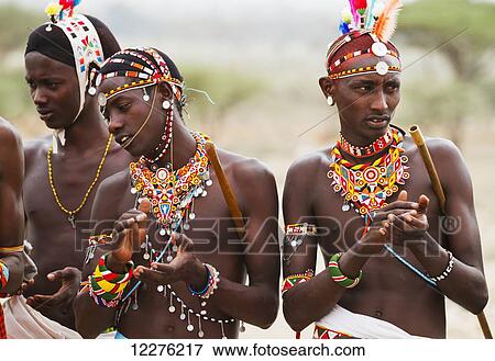 Stock Photo - Samburu men singing and dancing, Samburu County; Kenya. Fotosearch