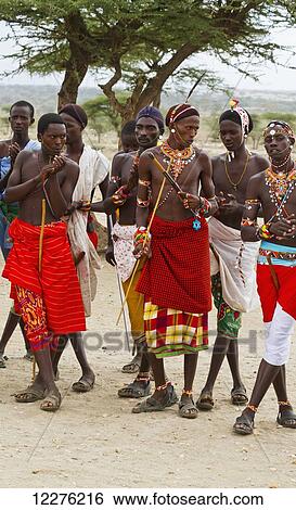 Stock Photograph - Samburu men singing and dancing, Samburu County; Kenya. Fotosearch