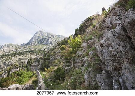 Stock Photo - San Giovanni Fortress Surrounds The Town Of Kotor. The Walls Surrounding The Town Are 5 Kilometers Long And Can Be Up To Twenty Meters Tall., Monte. Fotosearch