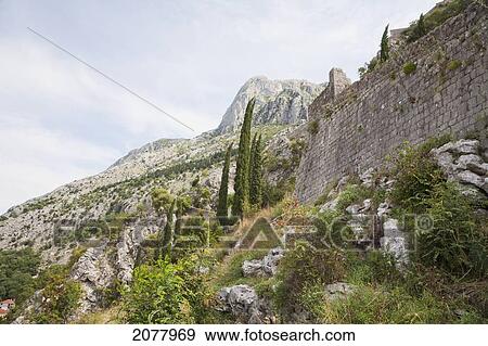 San Giovanni Fortress Surrounds The Town Of Kotor. The Walls Surrounding The Town Are 5 Kilometers Long And Can Be Up To Twenty Meters Tall., Monte View Large Photo Image Stock Photo - San Giovanni Fortress Surrounds The Town Of Kotor. The Walls Surrounding The Town Are 5 Kilometers Long And Can Be Up To Twenty Meters Tall., Monte. Fotosearch
