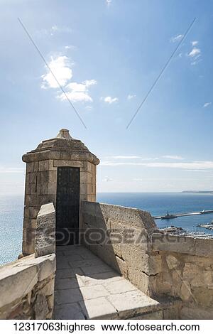 Stock Photograph - Santa Barbara Castle from Alicante, a fortress built at the end of eleventh century by Muslims; Alicante, Valencia, Spain. Fotosearch