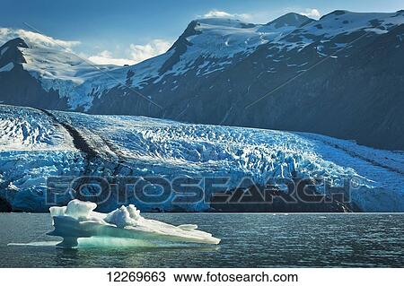 Stock Image - Scenic view of Portage Glacier with an iceberg, Chugach National Forest, Kenai Peninsula, Southcentral Alaska, Summer.. Fotosearch
