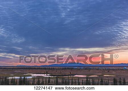 Scenic view of the village of Noatak with the Baird Mountains in the distance at sunrise, Arctic Alaska, USA, Autumn View Large Photo Image Stock Photo - Scenic view of the village of Noatak with the Baird Mountains in the distance at sunrise, Arctic Alaska, USA, Autumn. Fotosearch